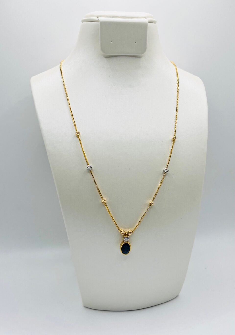 22kt gold two tone necklace with sapphire pendant